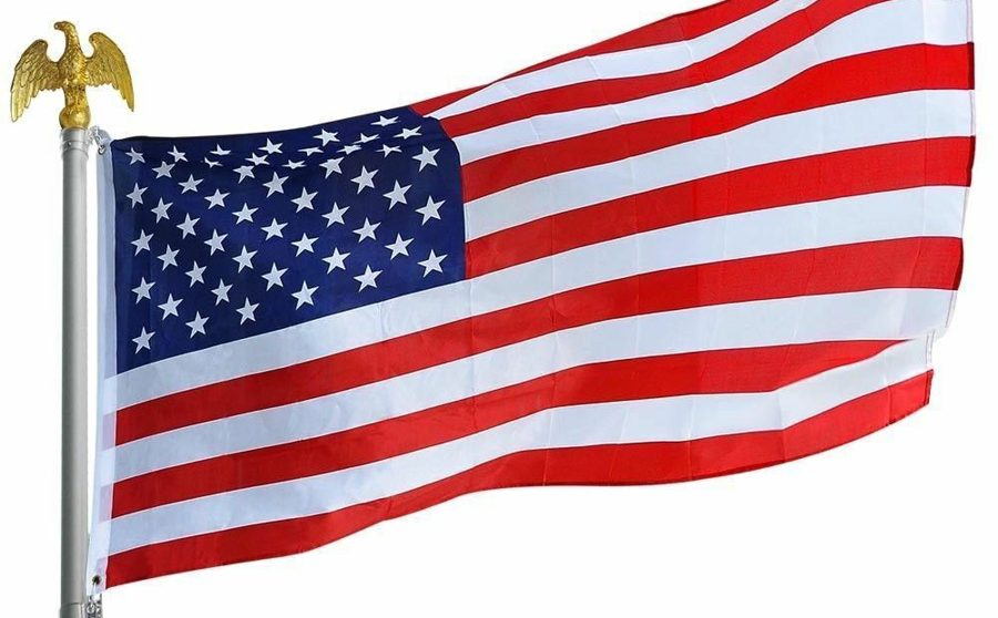 American flag flying from a pole topped with an eagle