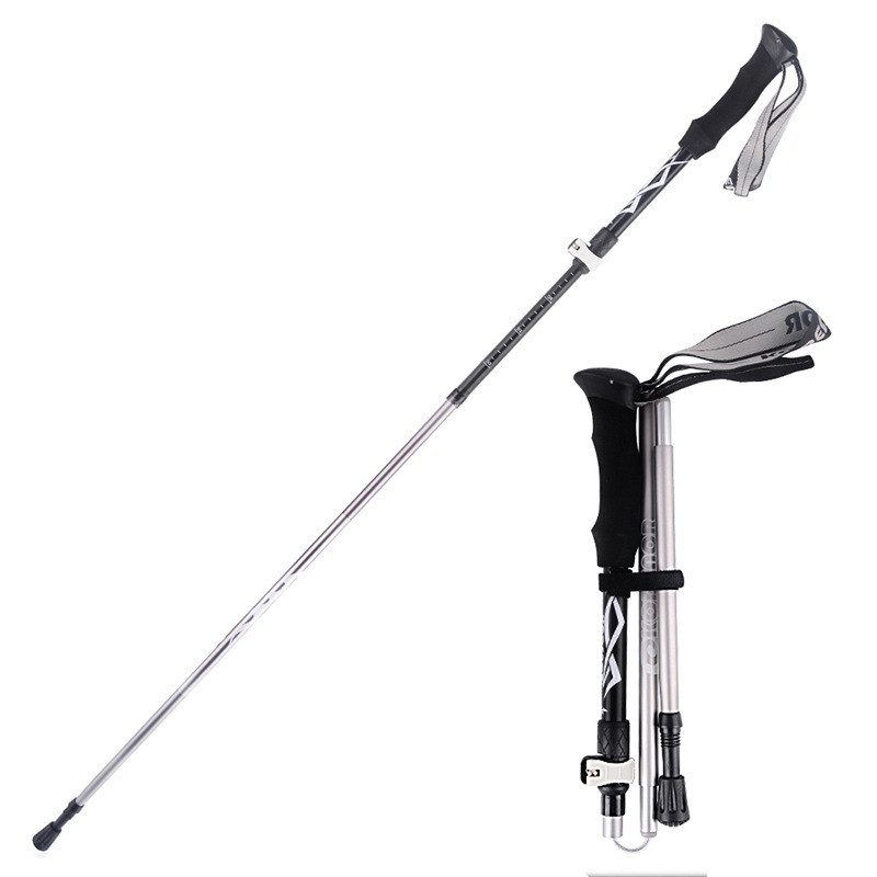 Black folding trekking pole shown extended and folded